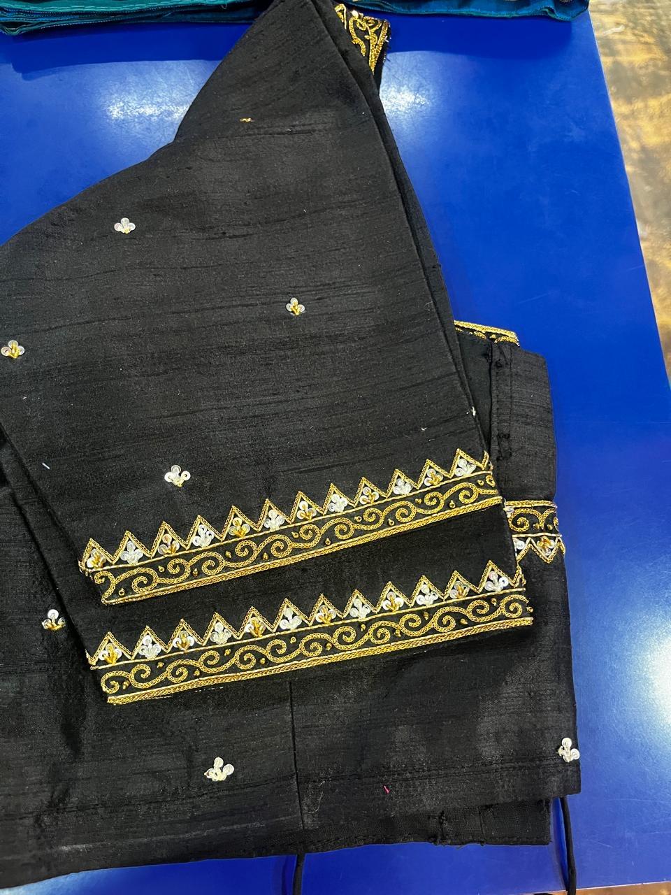 Black blouse with gold zari border and white sequin embellishments