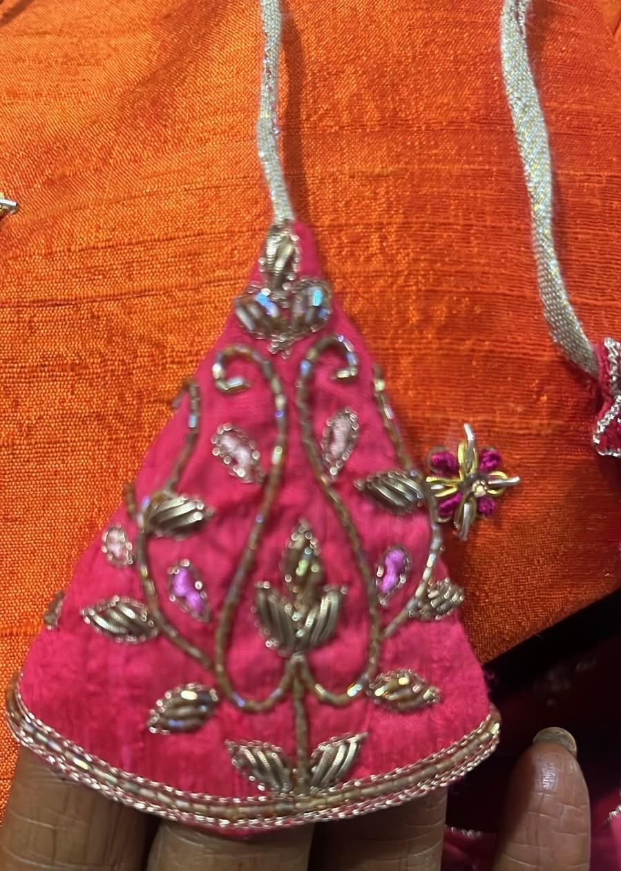 Magenta blouse with ornate maggam work and metallic embellishments