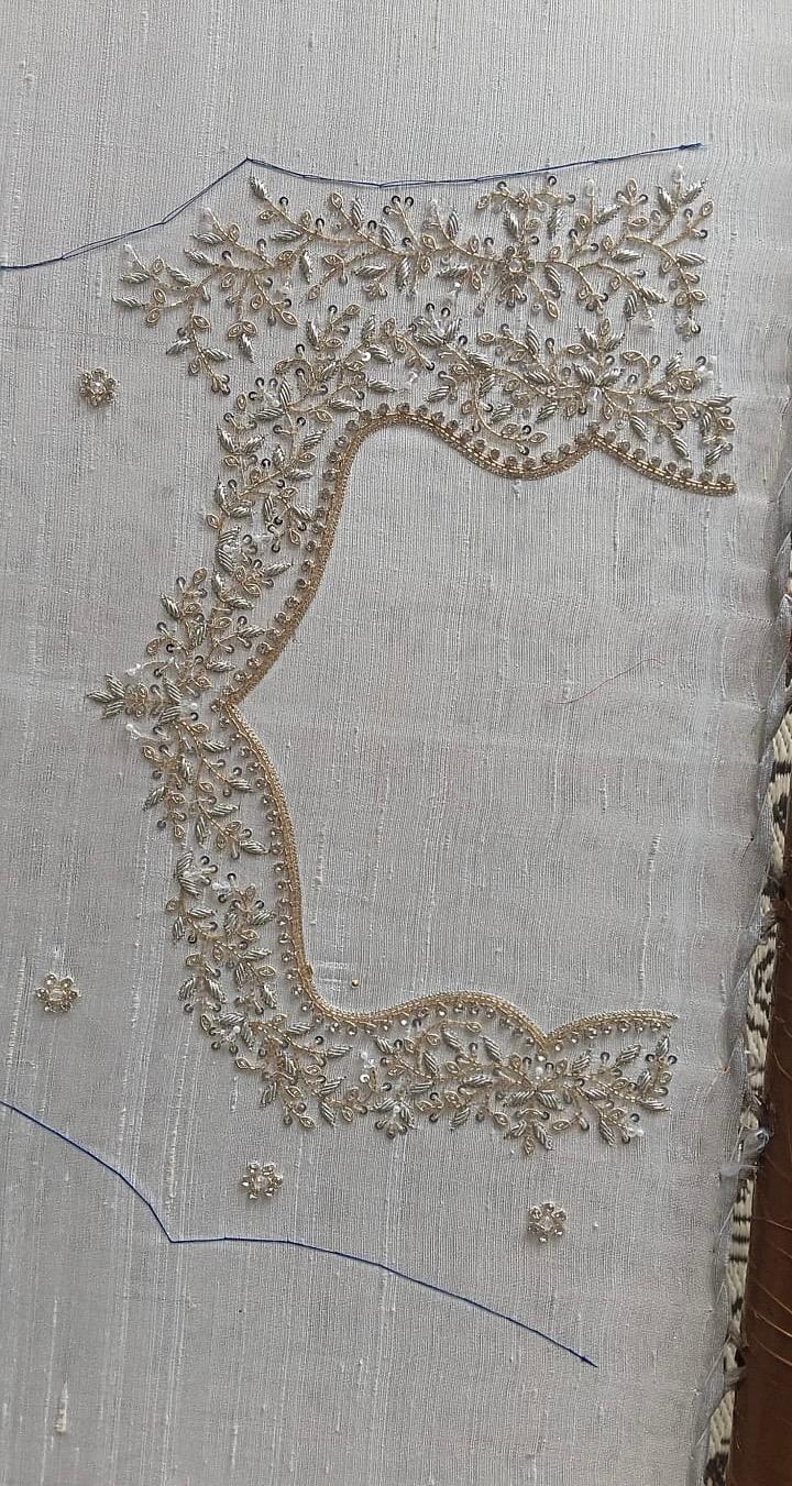 Cream blouse with dense beaded and sequin embroidery work