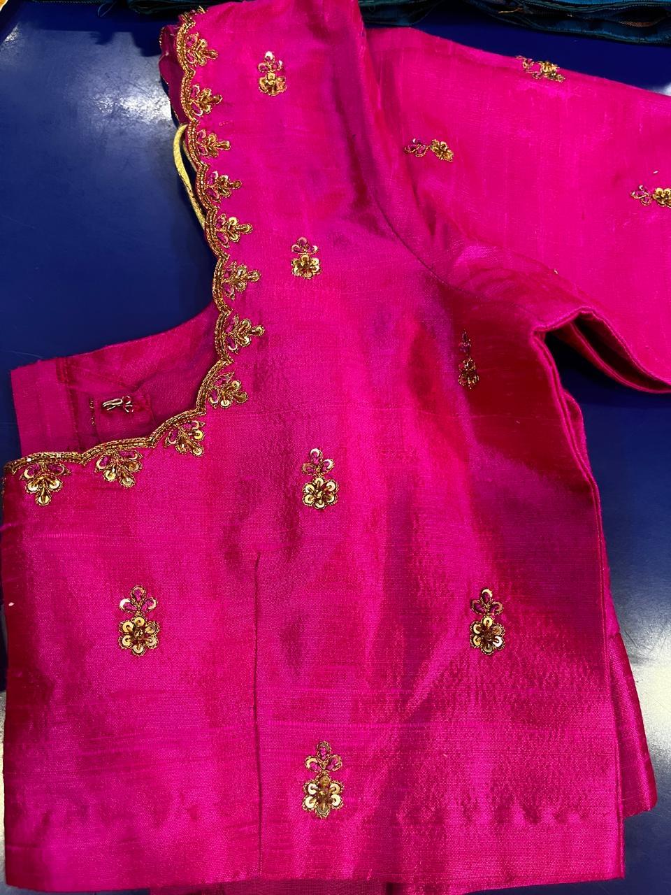 Bright pink blouse with gold zari floral embroidery and scalloped neckline