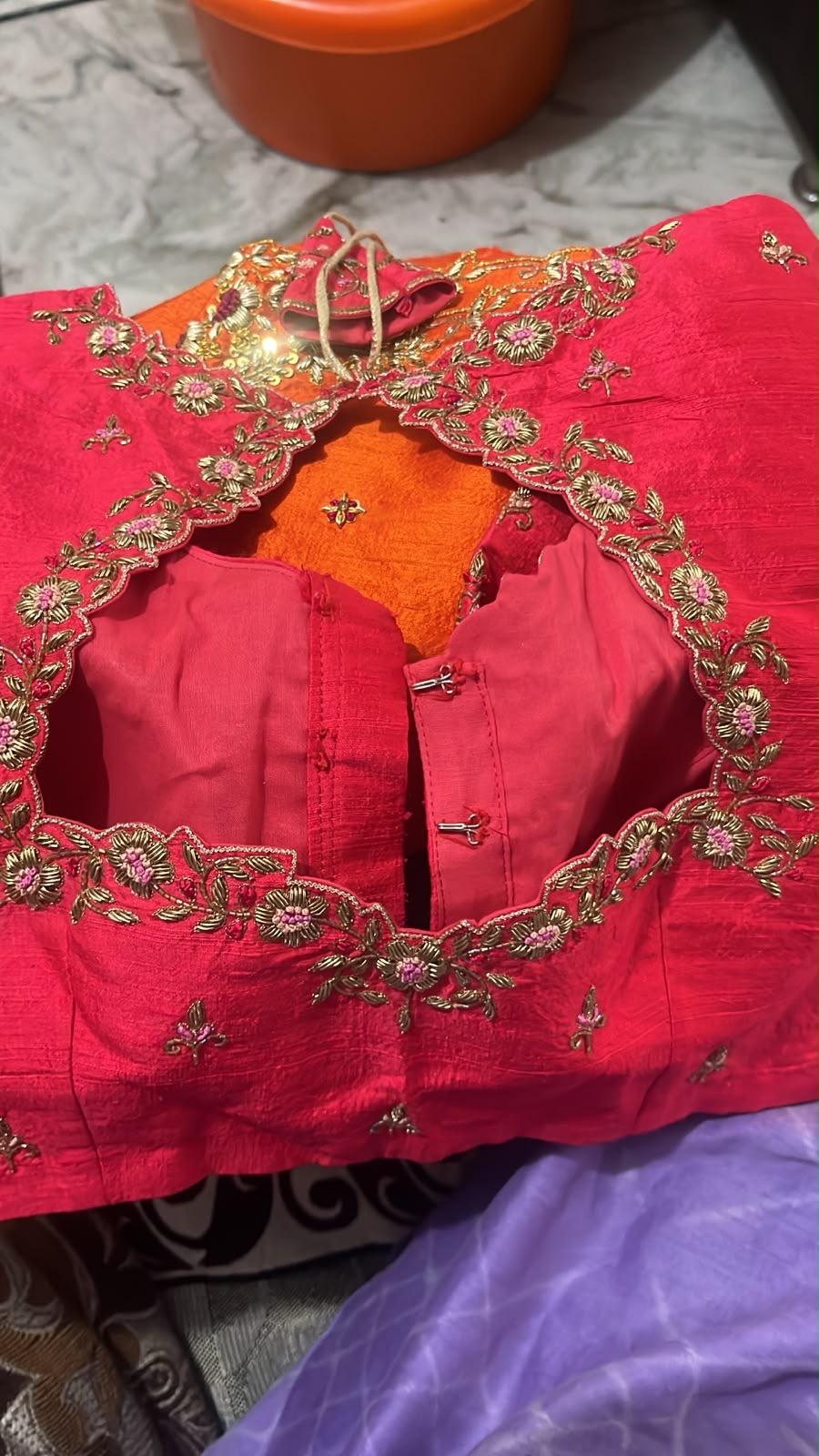 Hot pink bridal blouse with gold zari floral embroidery