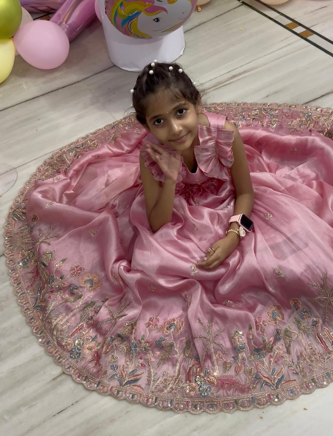 Pink embellished gown with elaborate gold zari border work