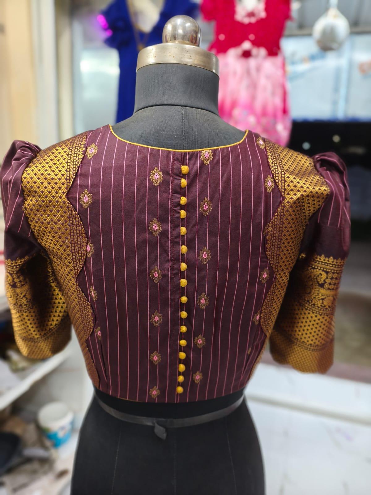 Maroon silk blouse with gold zari and maggam work embroidery