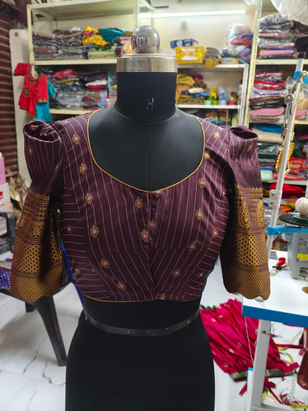 Maroon pinstriped blouse with gold zari floral embroidery and puff sleeves