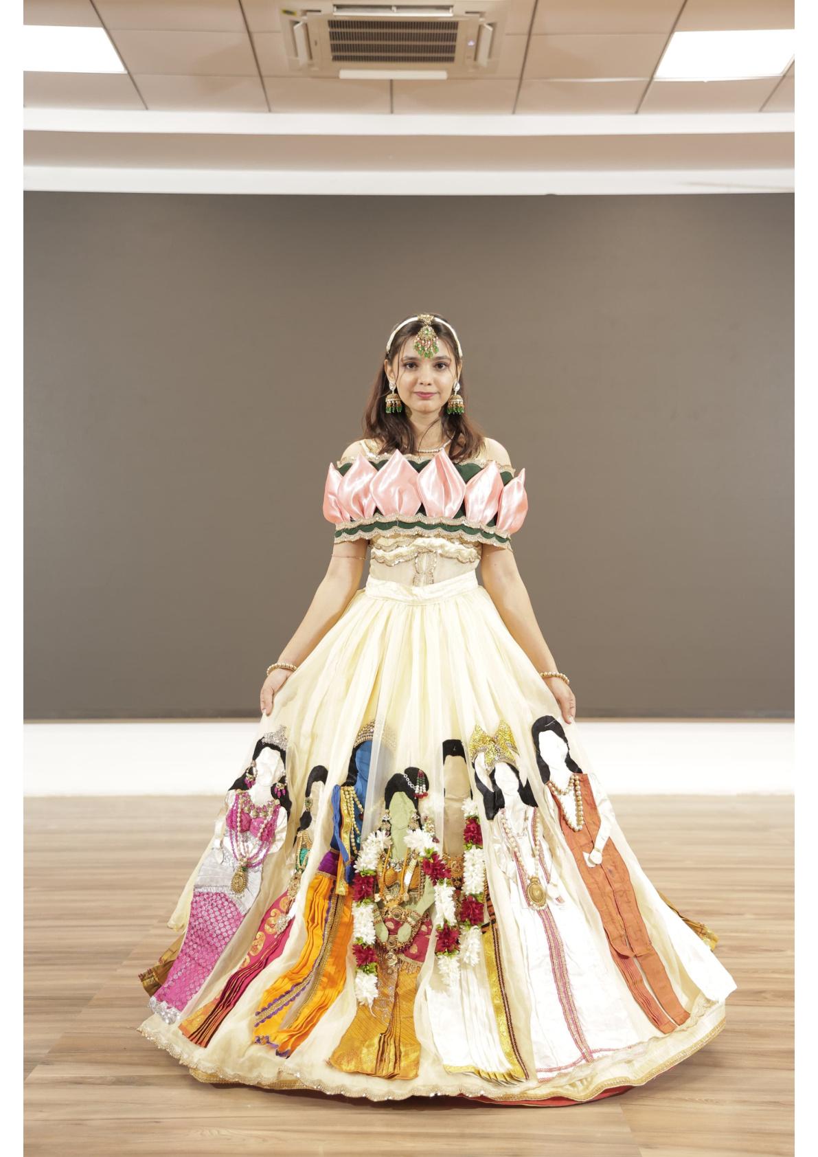 Cream gown with pink puff sleeves and illustrated skirt panel details