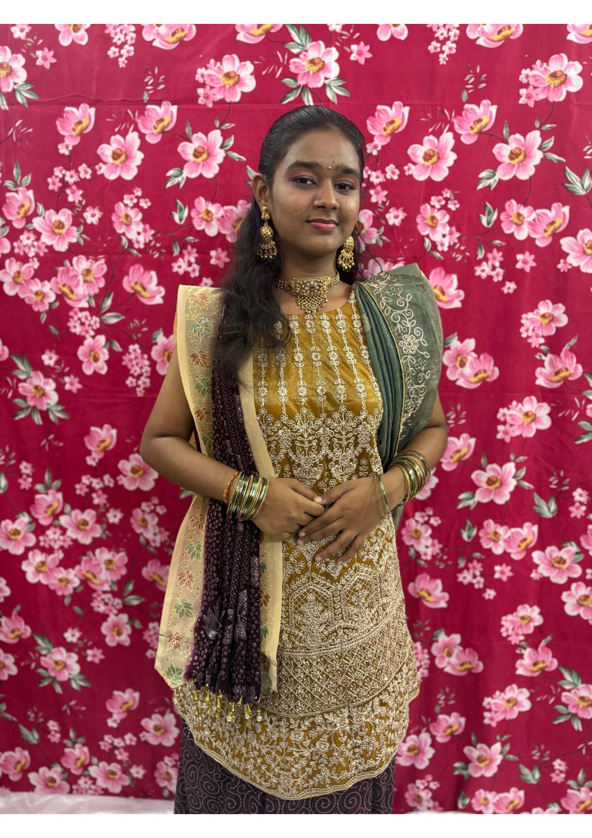 Gold zari embroidered kurti with matching dupatta and traditional jewelry