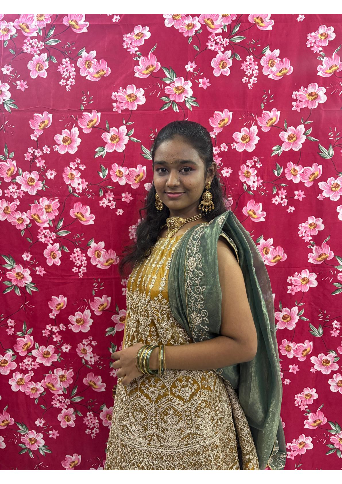 Gold embroidered blouse with green drape, traditional Indian ethnic wear