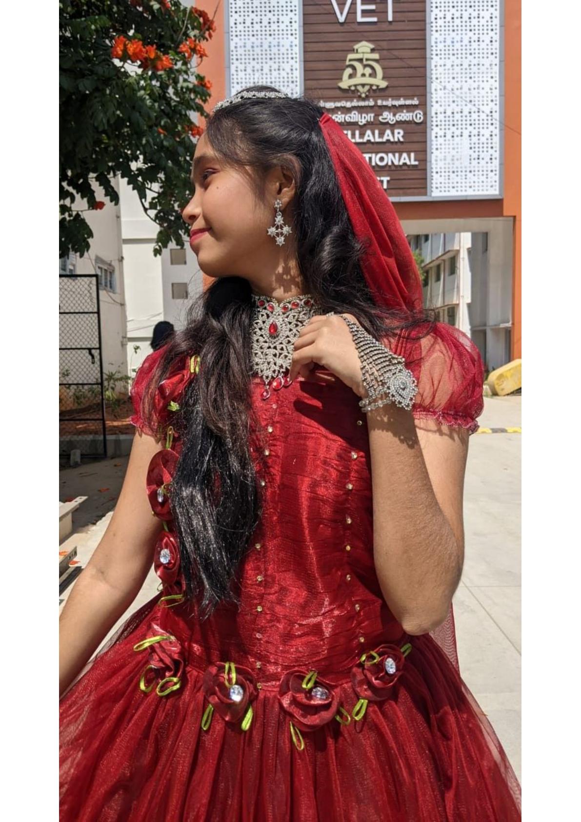 Red velvet gown with floral embroidered details and pearl embellishments