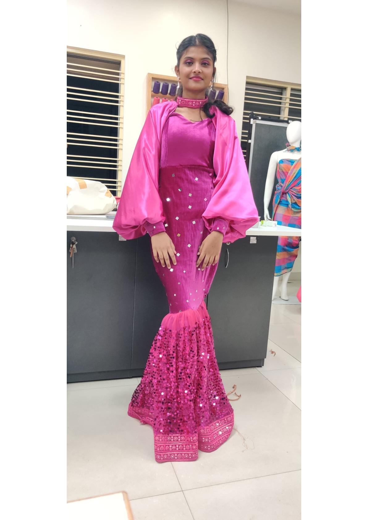 Pink mermaid gown with sequin embellishments and puffed sleeves