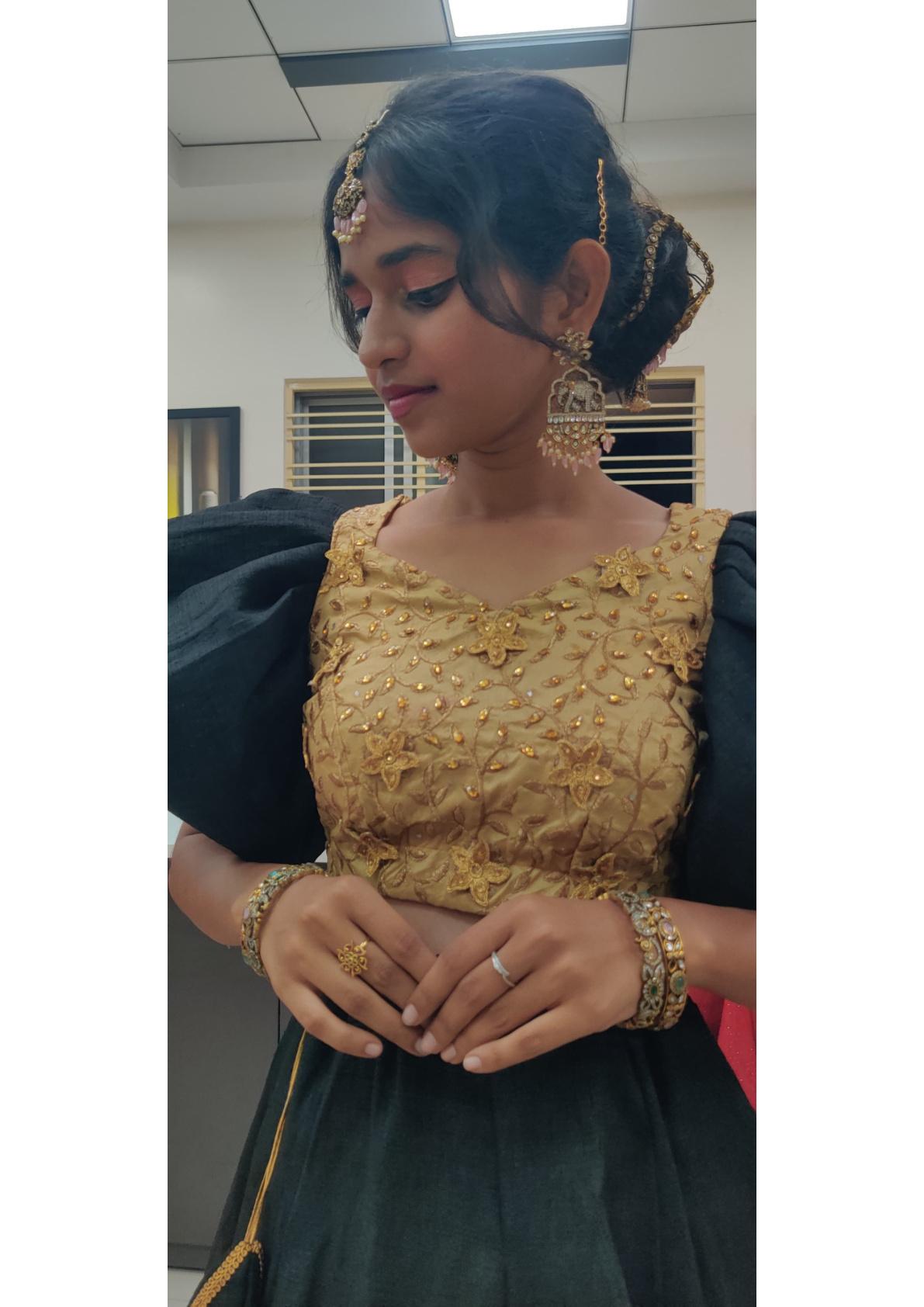 Gold maggam work blouse with black silk skirt half saree