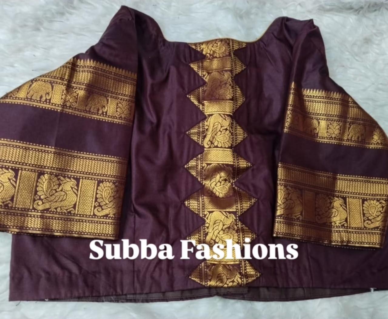 Maroon silk blouse with gold zari maggam work and traditional patterns