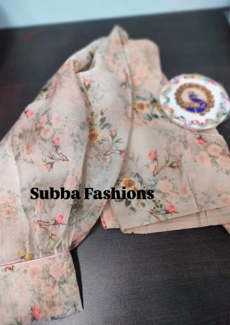 Cream floral printed saree with decorative brooches and traditional styling