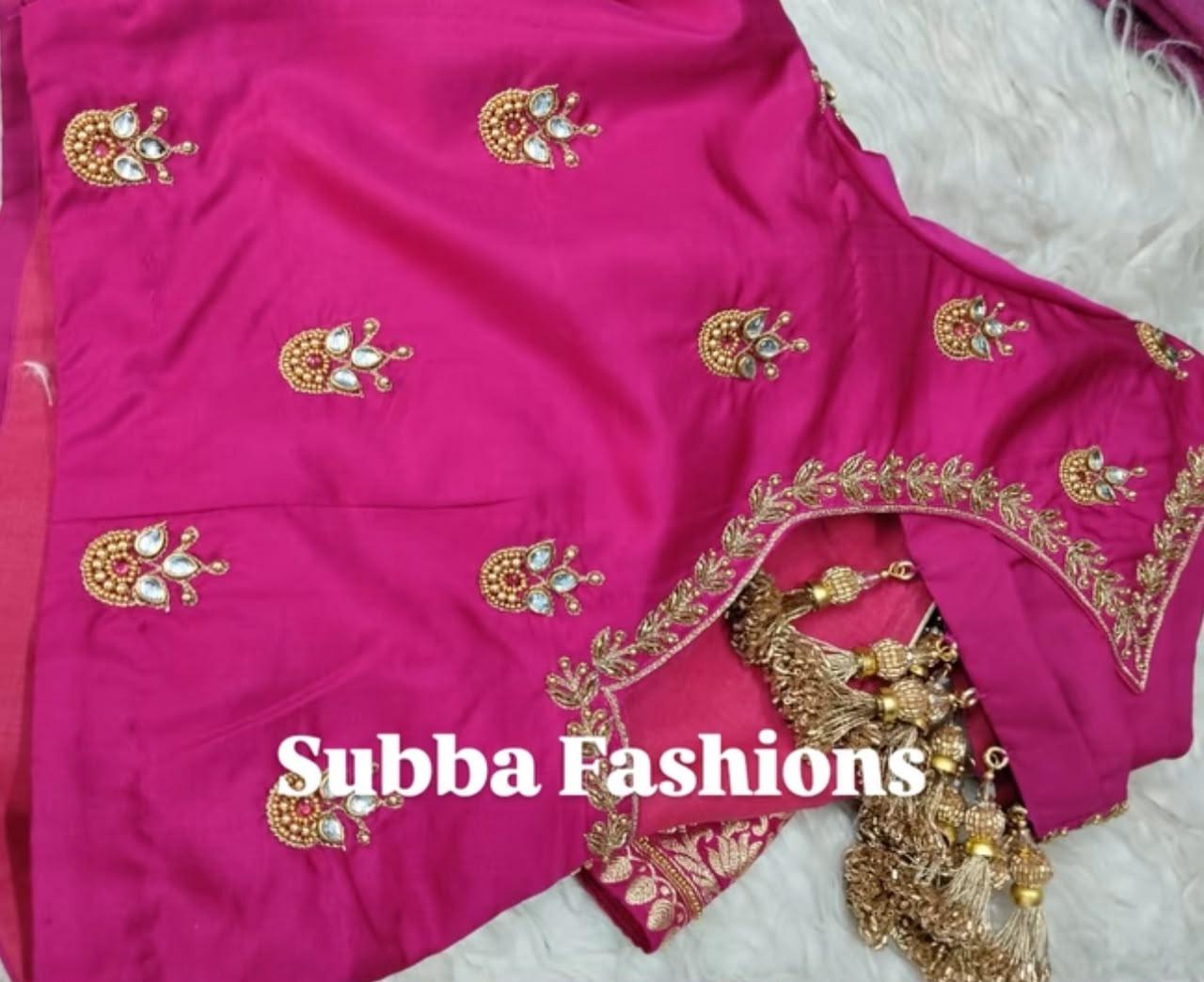 Magenta blouse with gold peacock motifs and zari embroidery