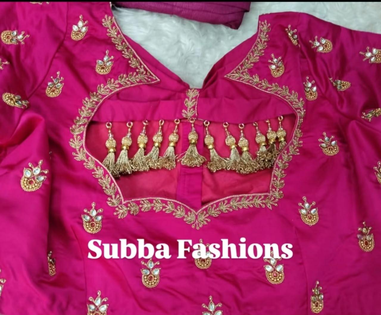 Magenta bridal blouse with gold zari embroidery and tassel details