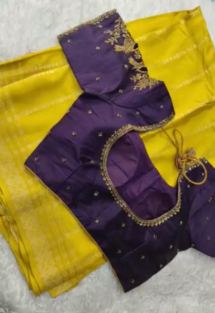 Purple blouse with gold zari embroidery and yellow silk saree