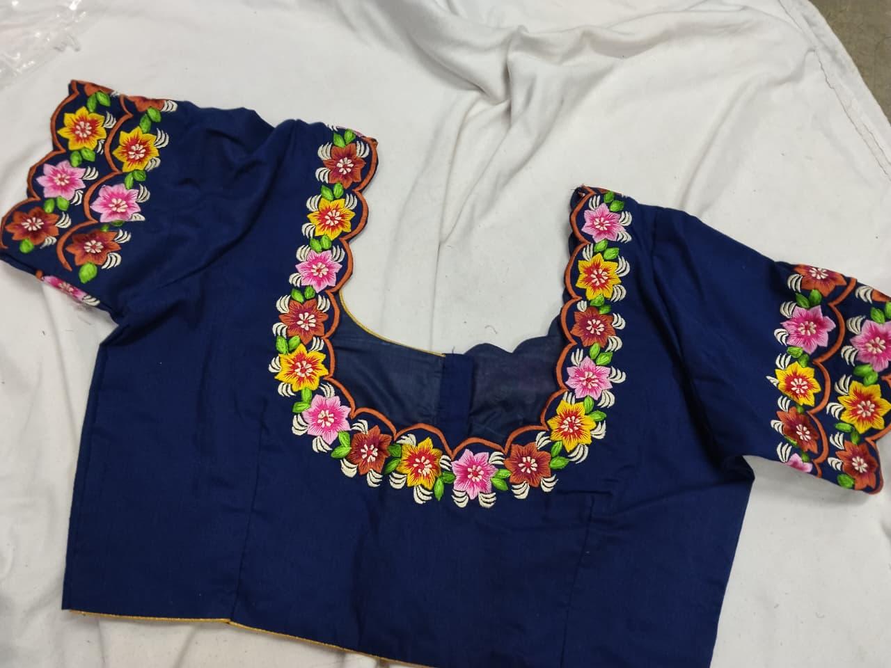 Navy blue blouse with vibrant floral embroidery and colorful neckline