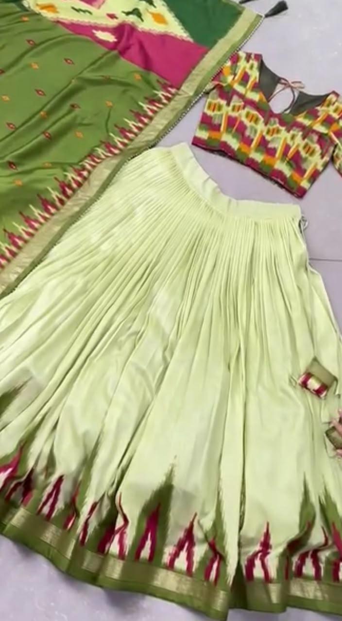 Light green pleated skirt with magenta flame pattern border