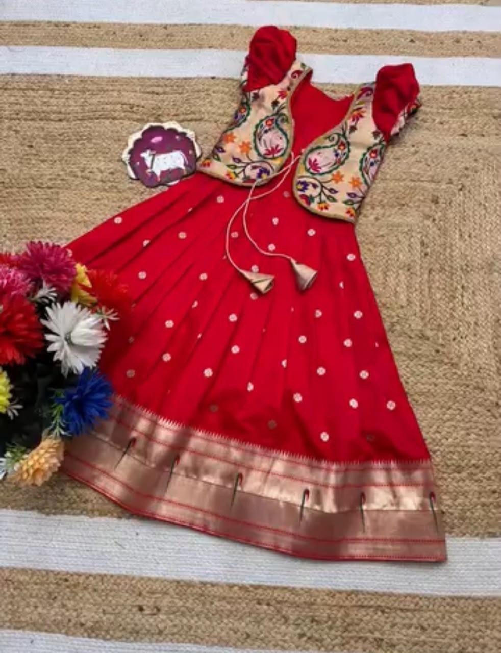 Red silk saree with embroidered blouse and gold border