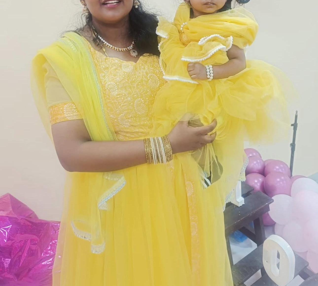 Yellow traditional ensemble with white pearl embellishments for mother-daughter