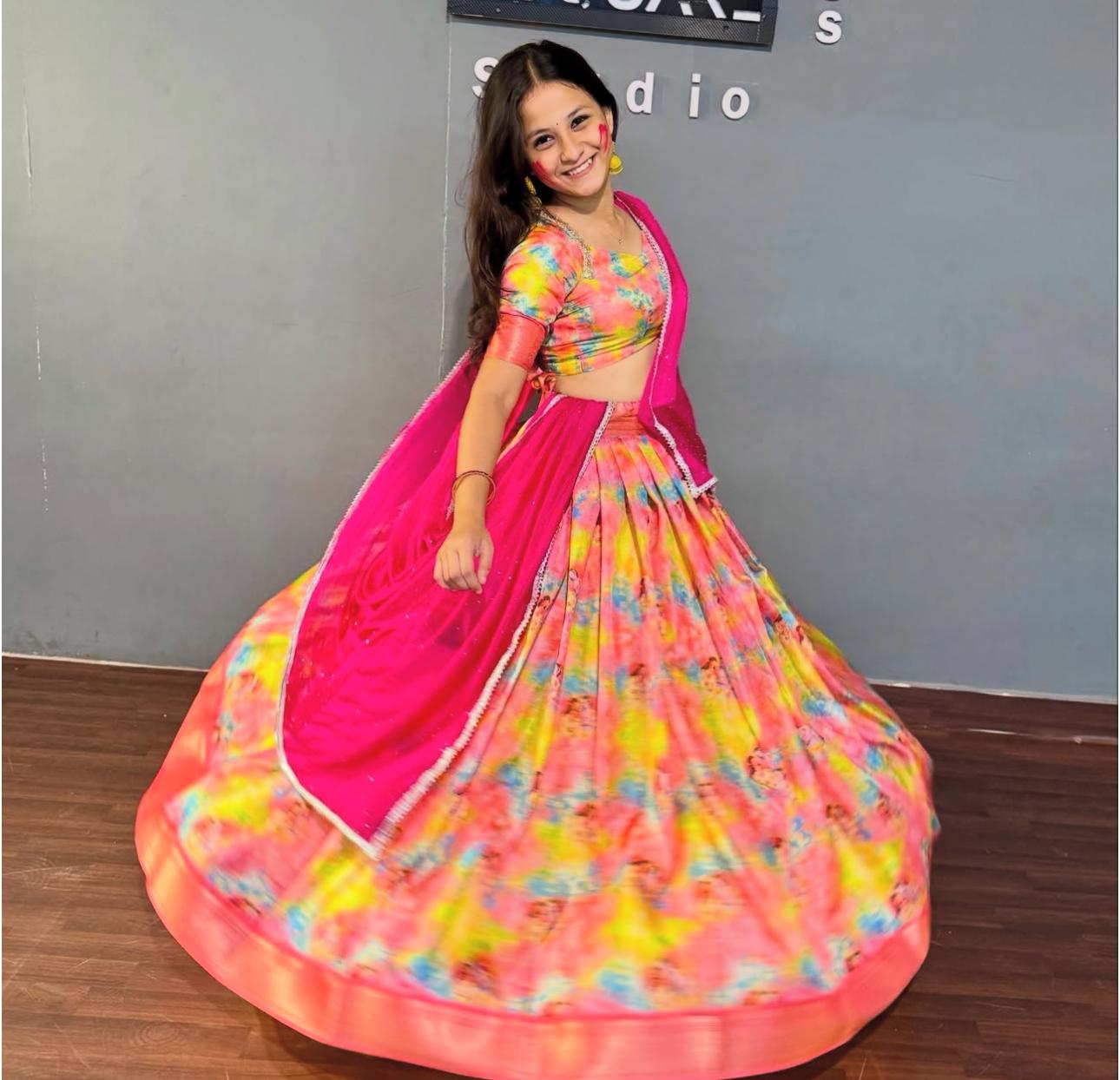 Vibrant pink half saree with multicolor floral print and matching blouse