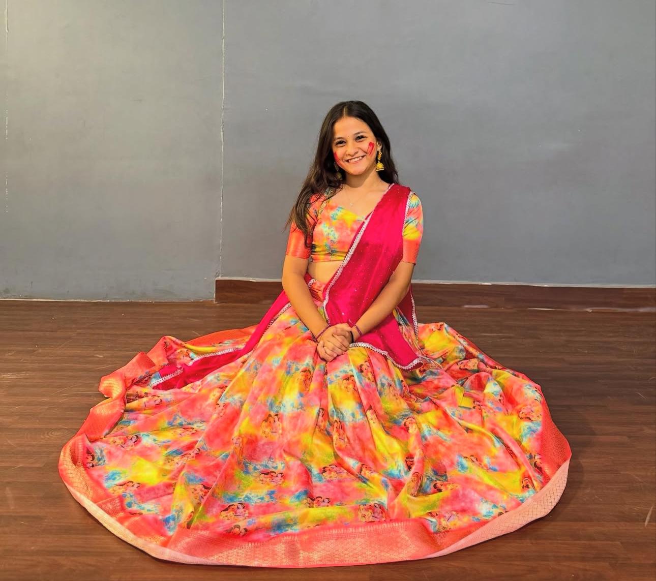 Vibrant multicolor half saree with floral print and pink blouse