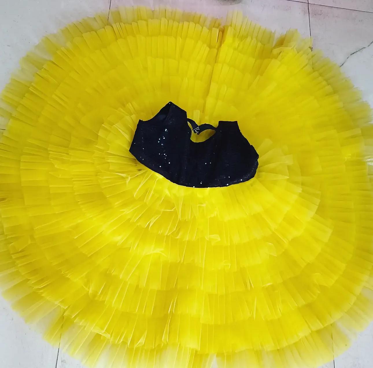 Bright yellow tulle tutu skirt with black sequined waistband