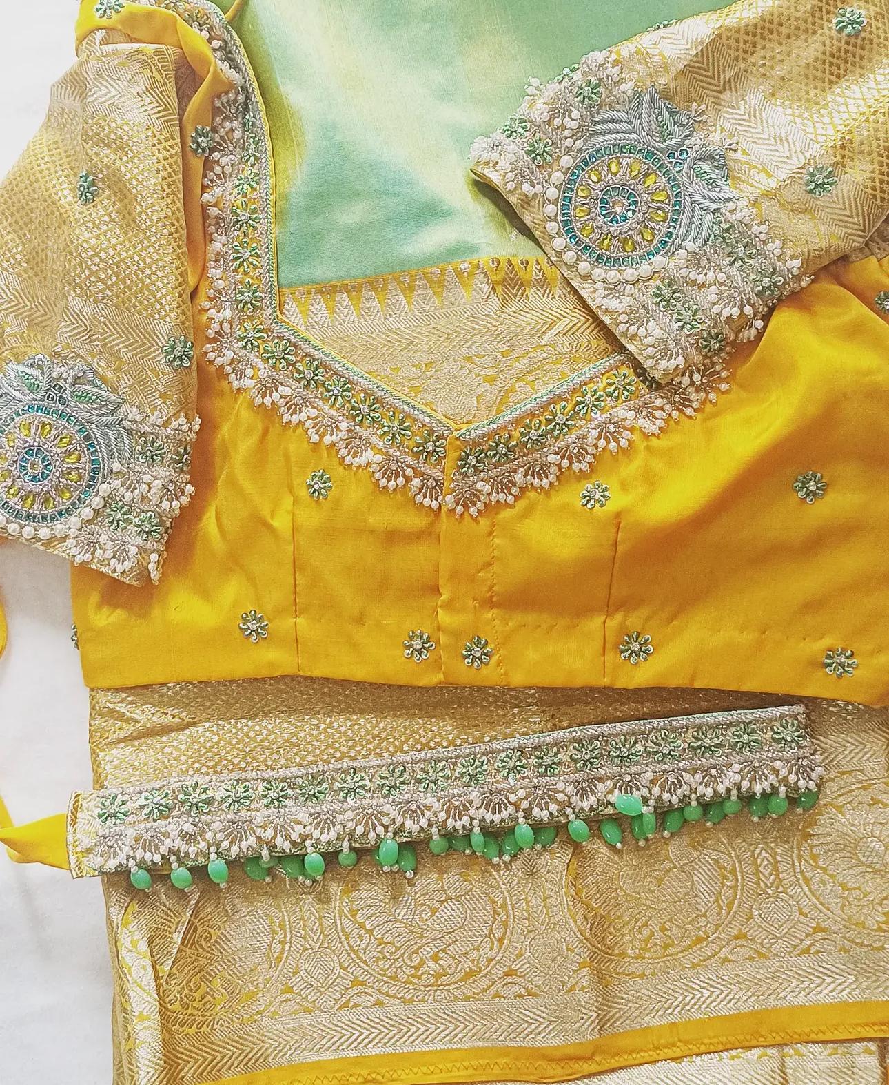 Yellow silk blouse with ornate zari and stone embroidered borders