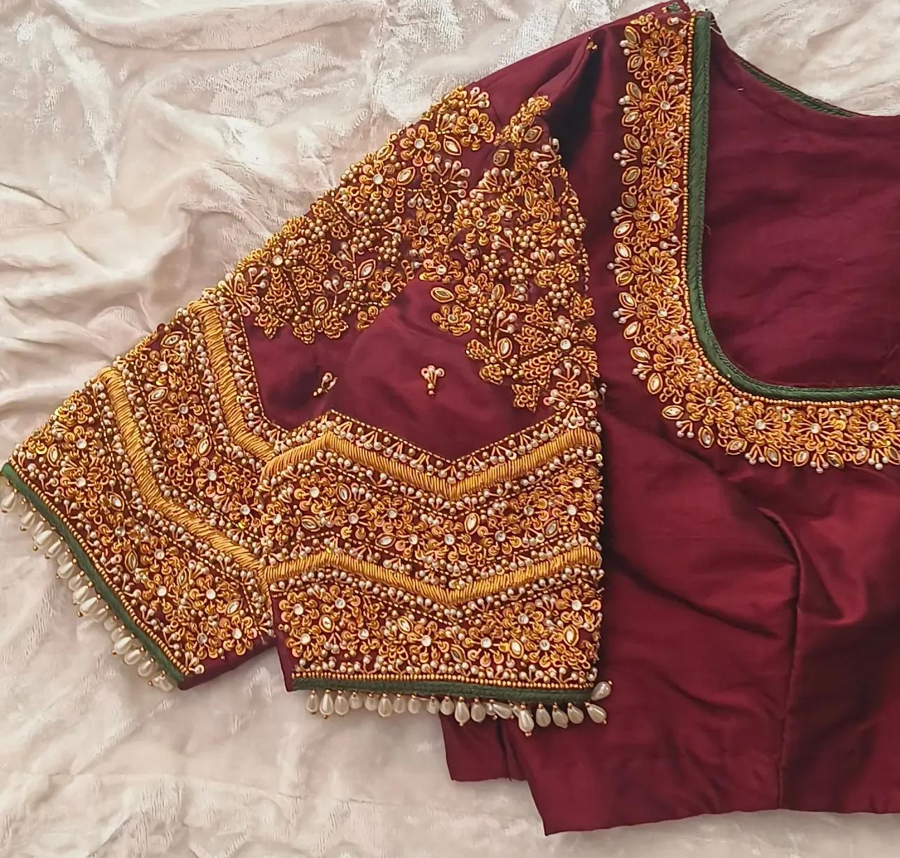 Maroon bridal blouse with gold maggam work embroidery