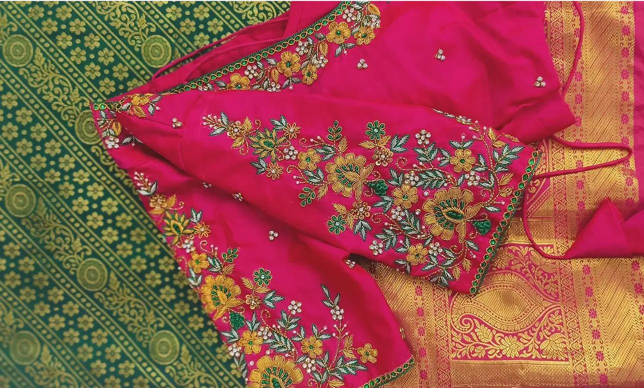 Pink silk saree with gold floral embroidery and zari border