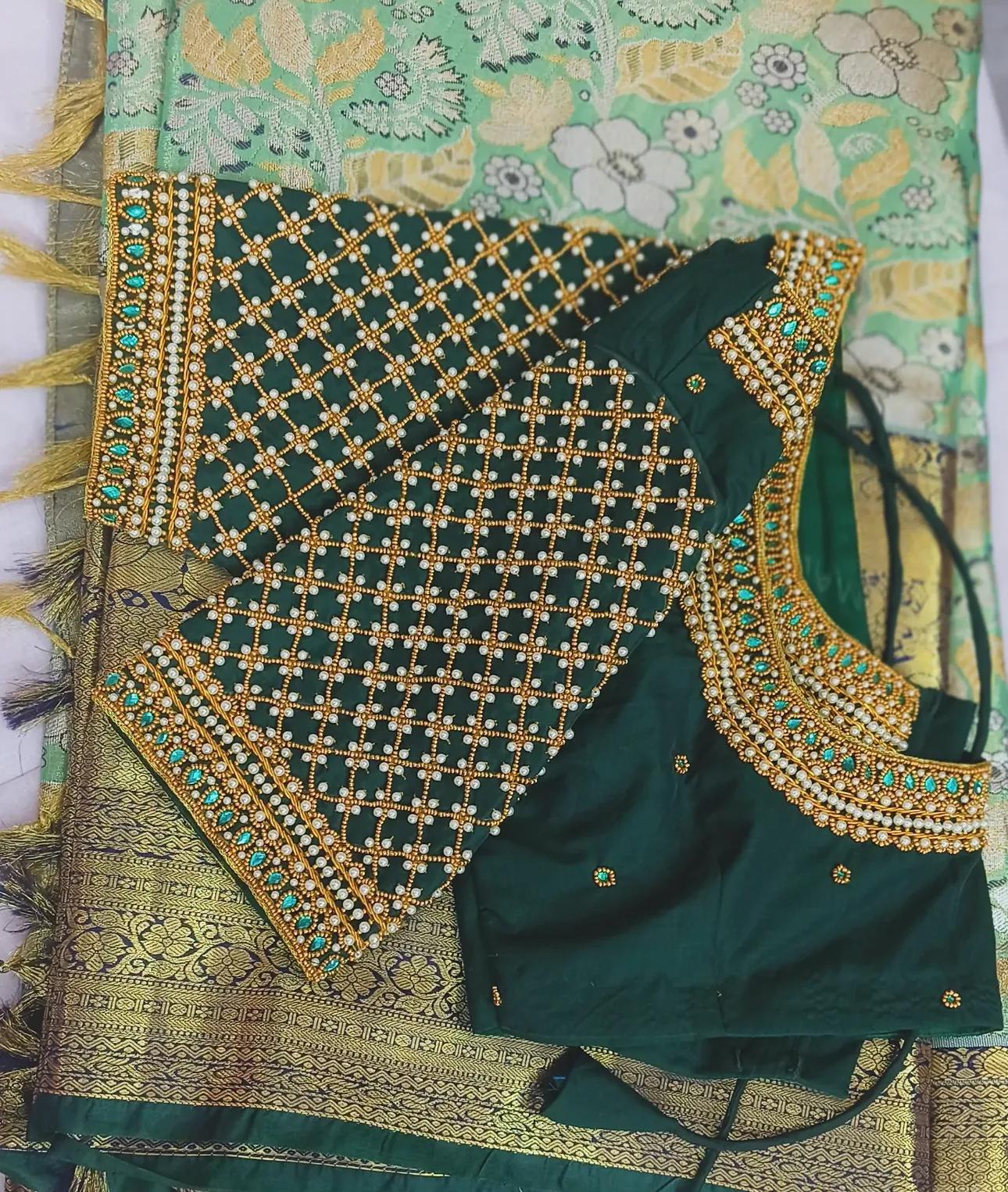 Forest green bridal blouse with gold zari and stone embroidery work