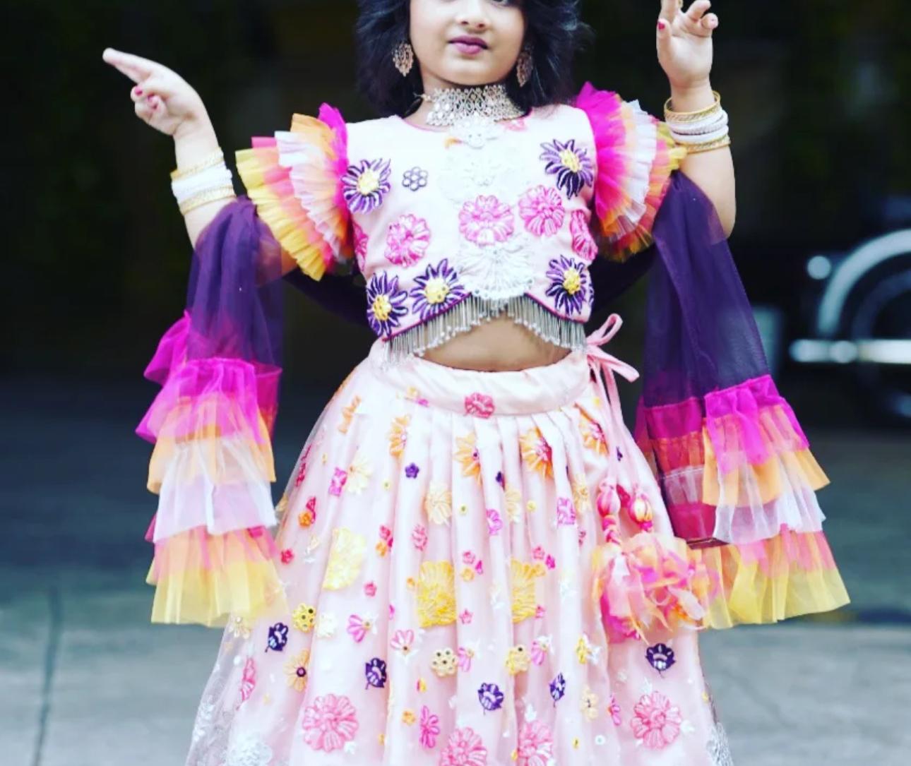 Colorful kids party wear with floral prints and rainbow ruffle sleeves