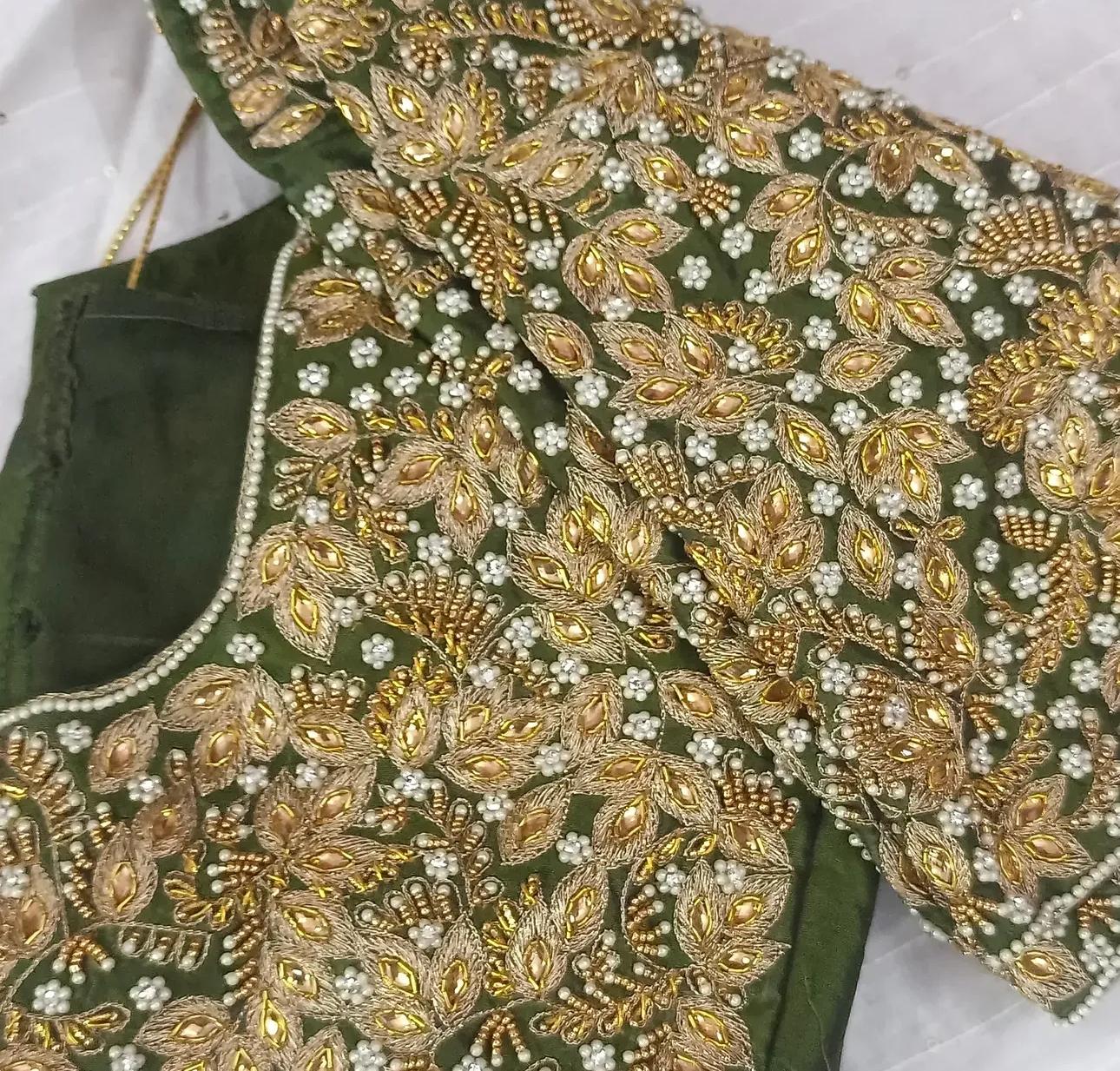 Green bridal blouse with gold zari and pearl maggam embroidery