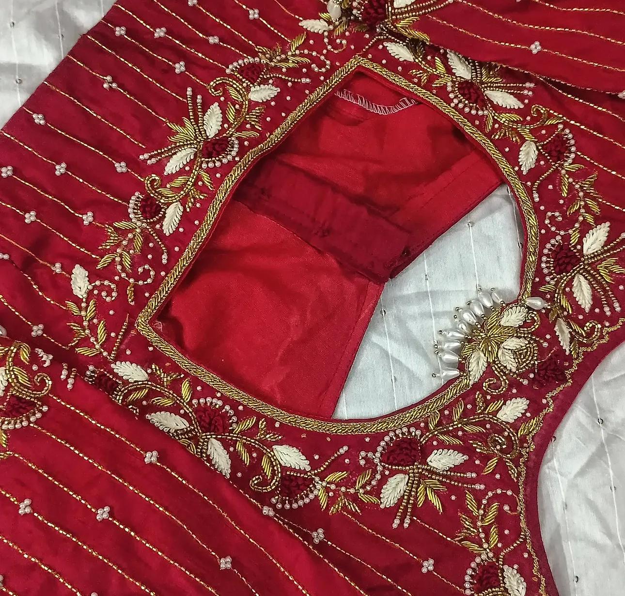 Red bridal blouse with gold zari and pearl embroidery work