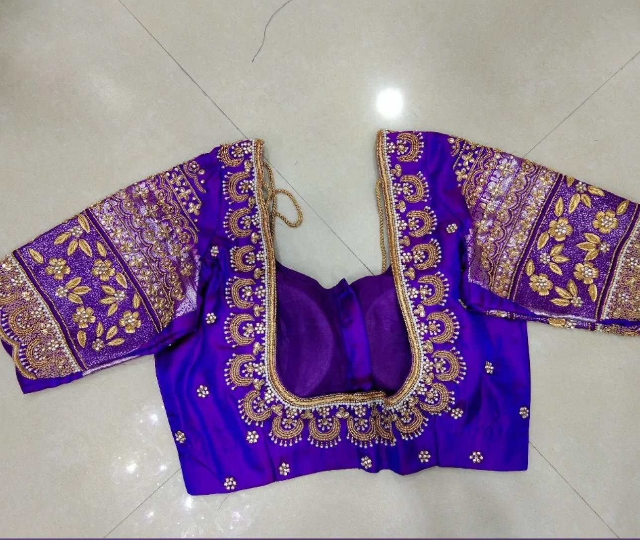 Purple bridal blouse with gold zari embroidery and floral maggam work
