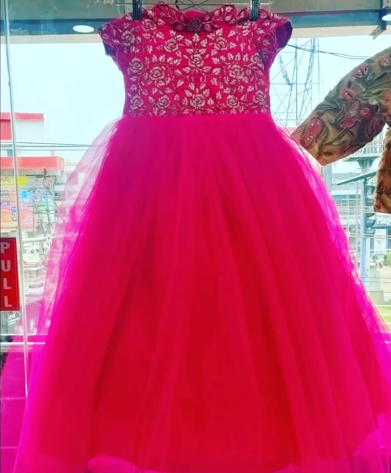 Bright pink ball gown with embroidered bodice and tulle skirt