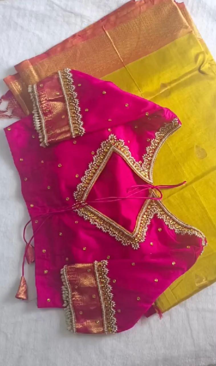 Magenta silk blouse with gold zari embroidery and contrast peach borders