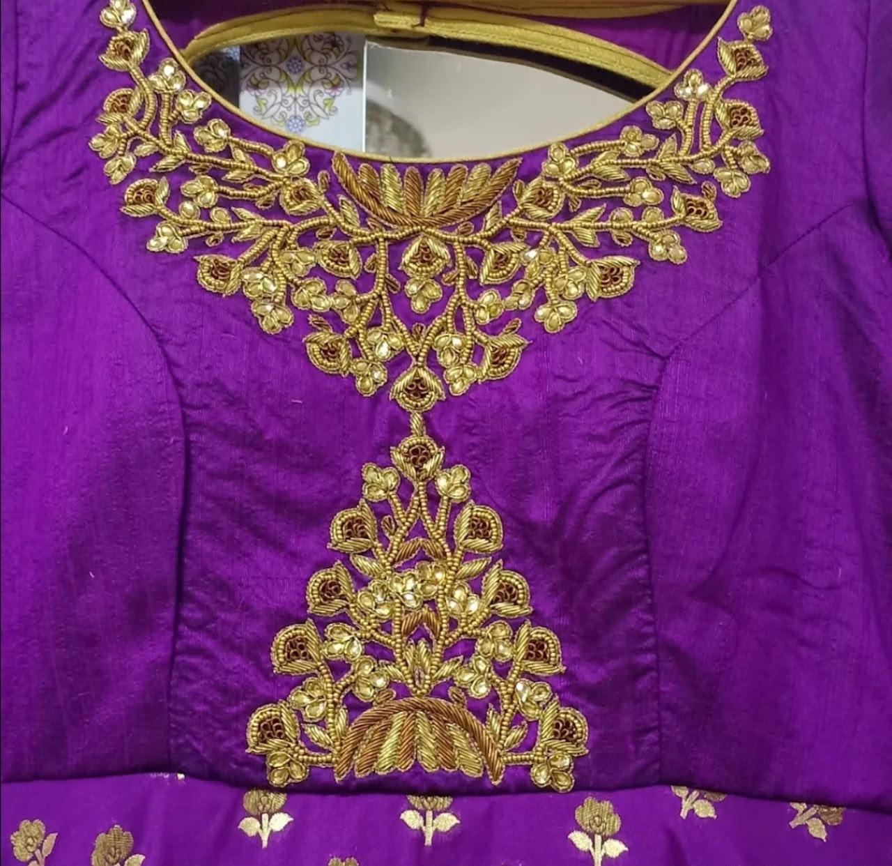 Purple silk blouse with intricate gold zari embroidery and floral maggam work
