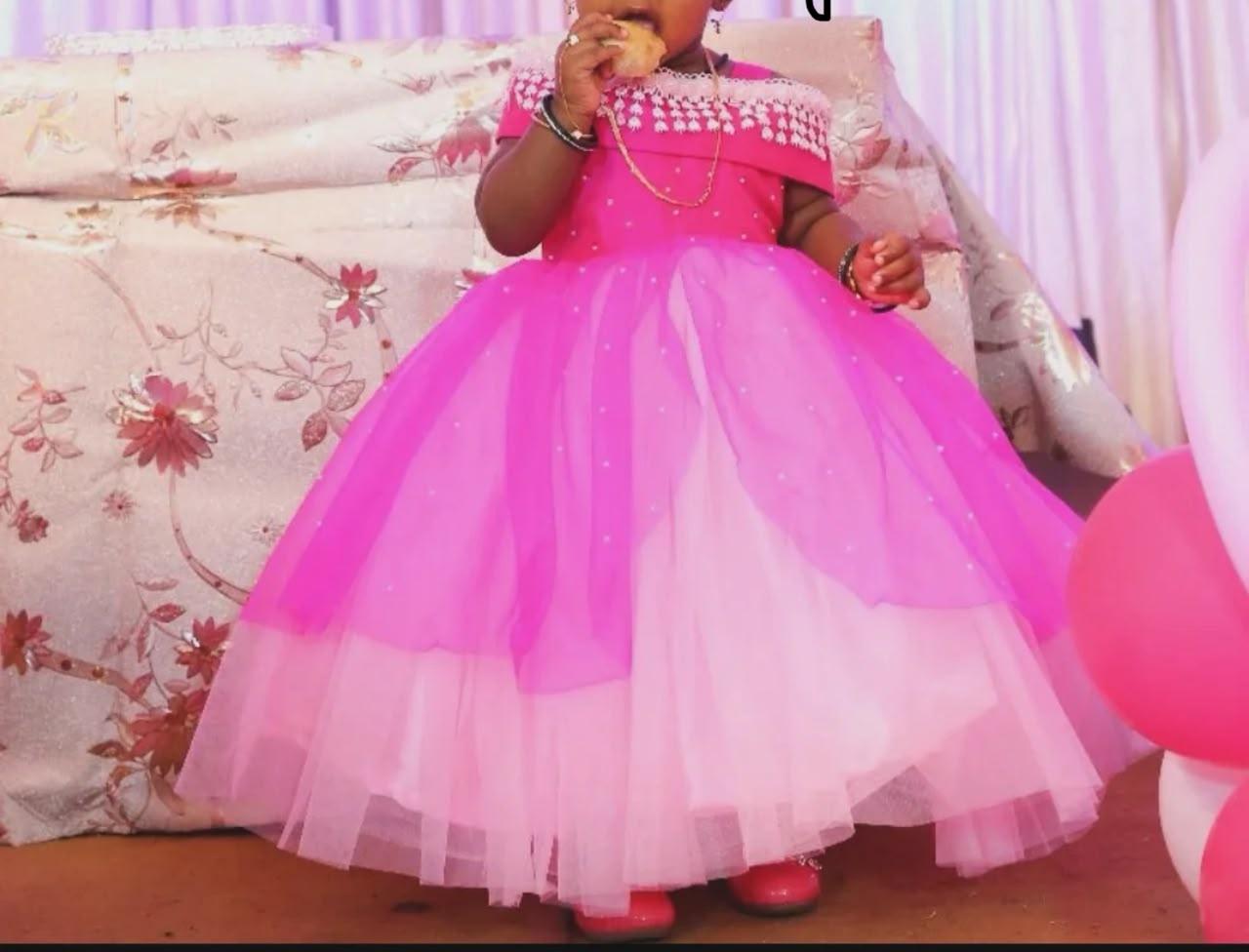 Bright pink girls party wear gown with pearl embellishment and tulle skirt