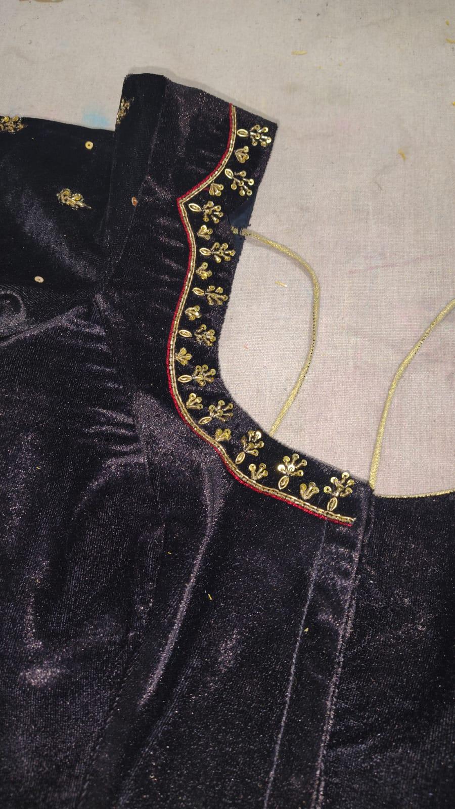 Black velvet blouse with gold zari floral embroidery and red piping trim