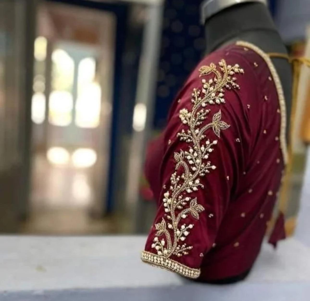 Maroon bridal blouse with gold zari floral embroidery and pearl beadwork