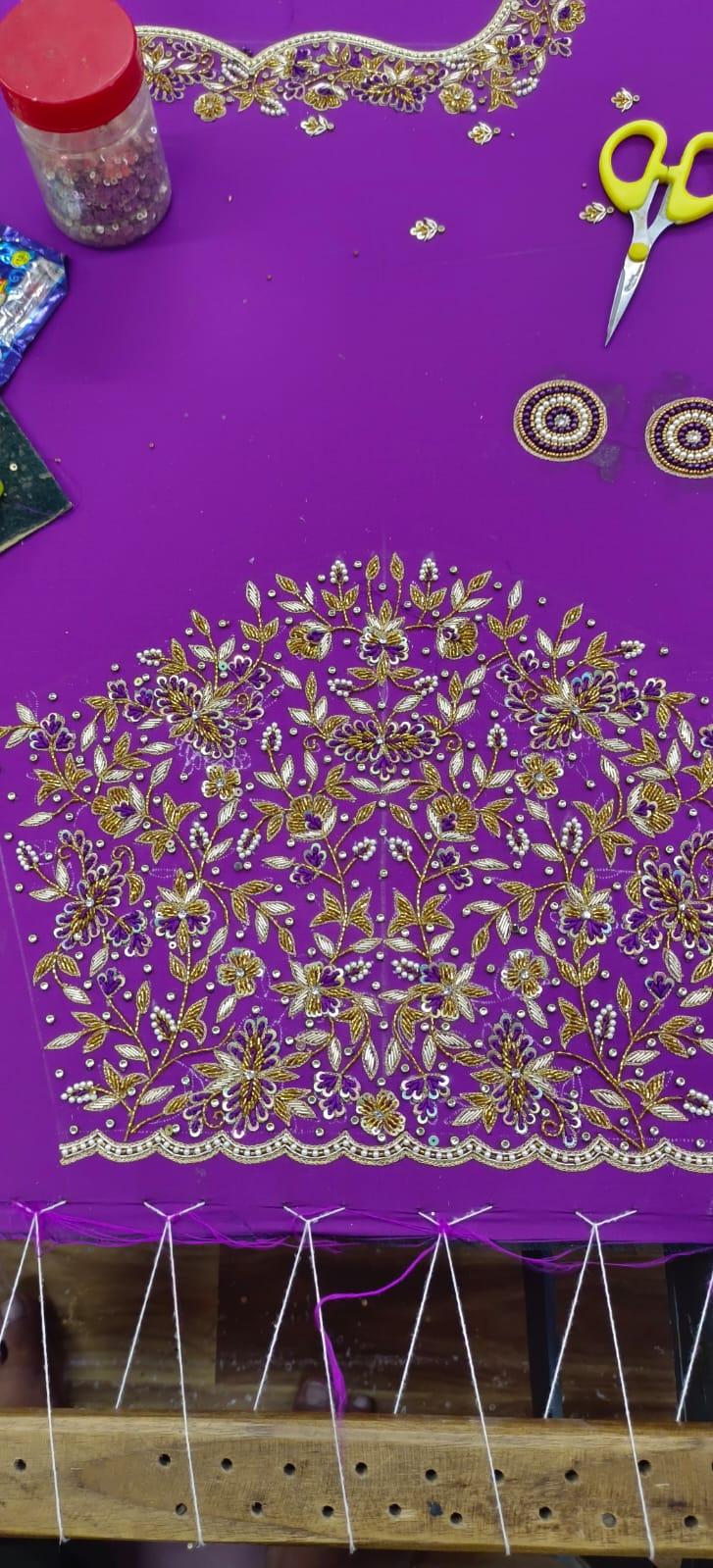 Purple fabric with gold zari floral embroidery and pearl beadwork