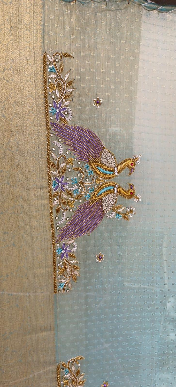 Purple maggam work blouse with peacock design and floral embellishments