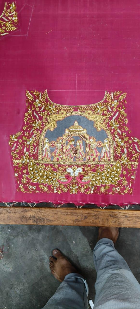 Magenta silk blouse with intricate gold zari and maggam work embroidery