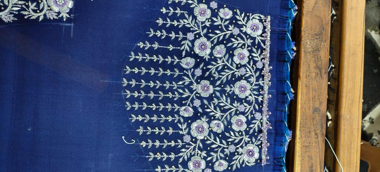 Navy blue silk saree with intricate floral embroidery and zari work