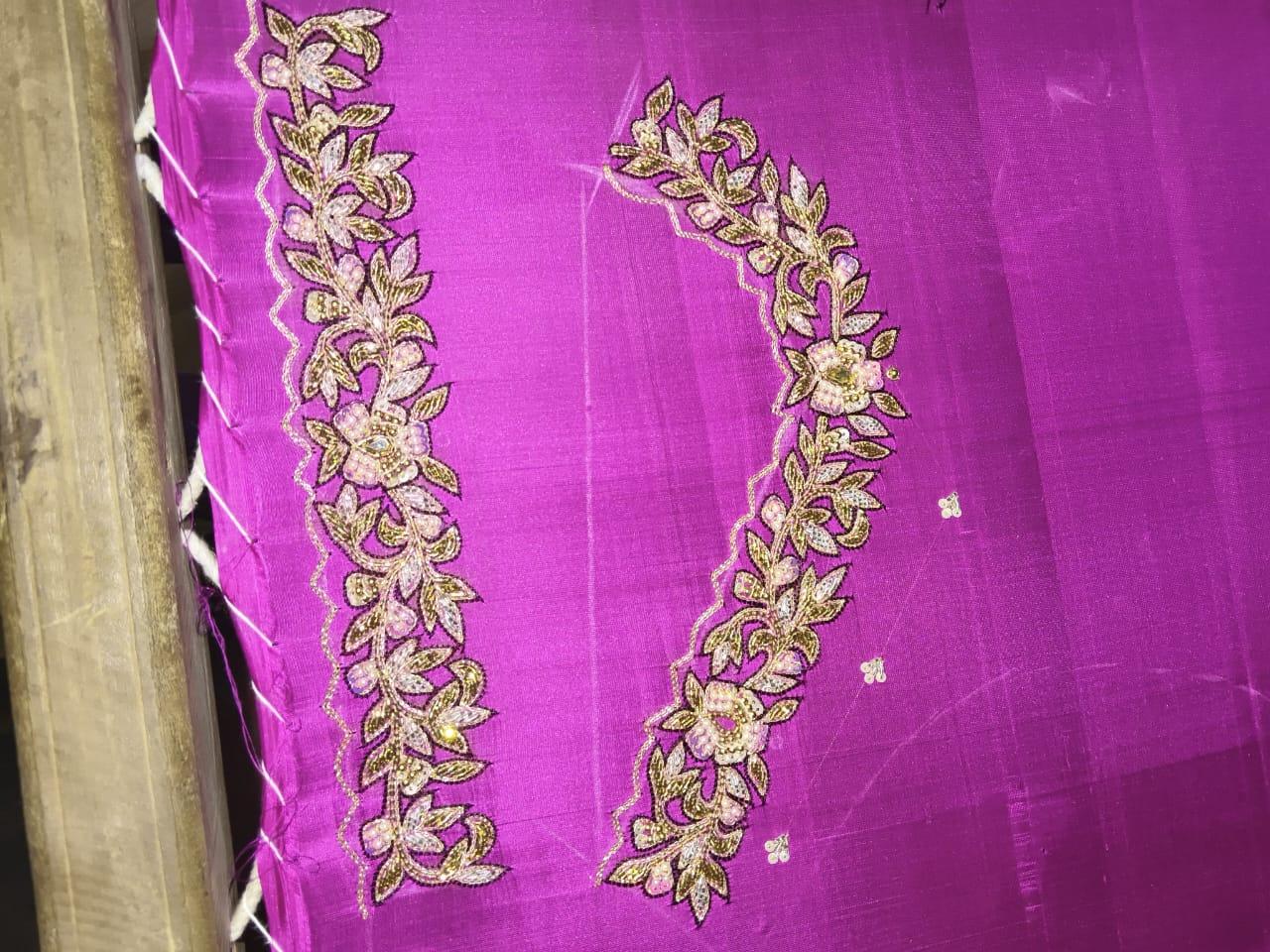 Magenta silk saree with gold zari floral embroidery borders
