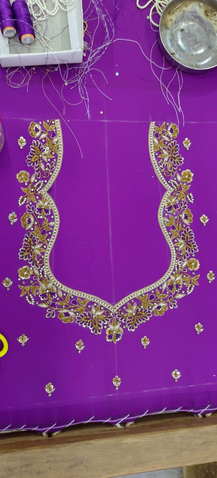 Purple saree with gold zari floral maggam work neckline embroidery