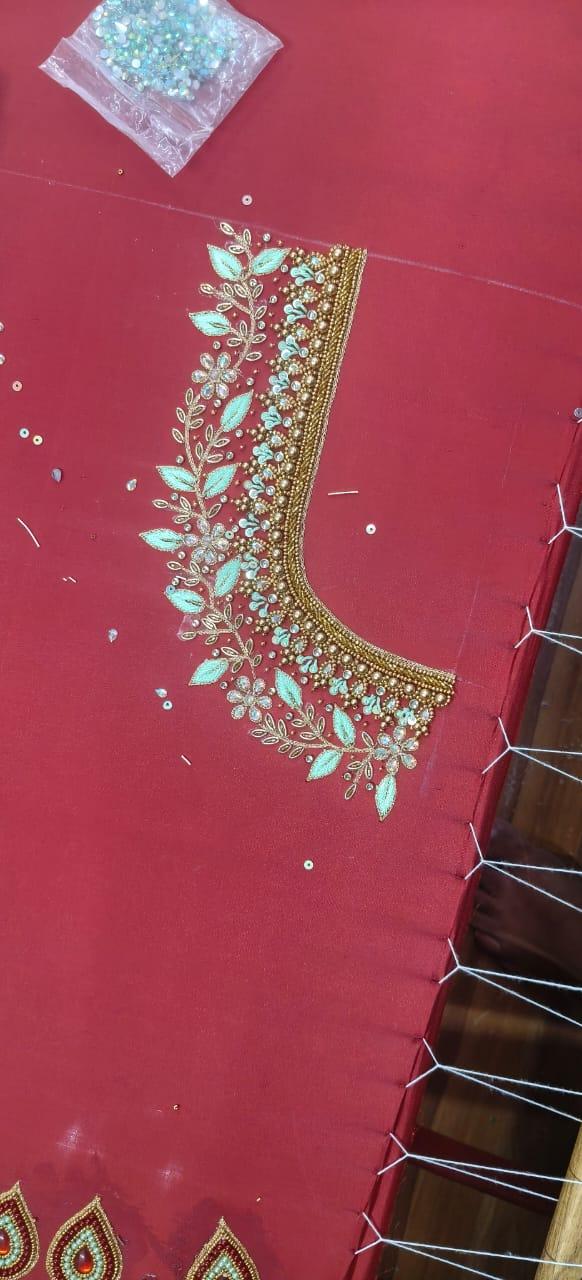 Red bridal blouse with turquoise stone and gold zari embroidery