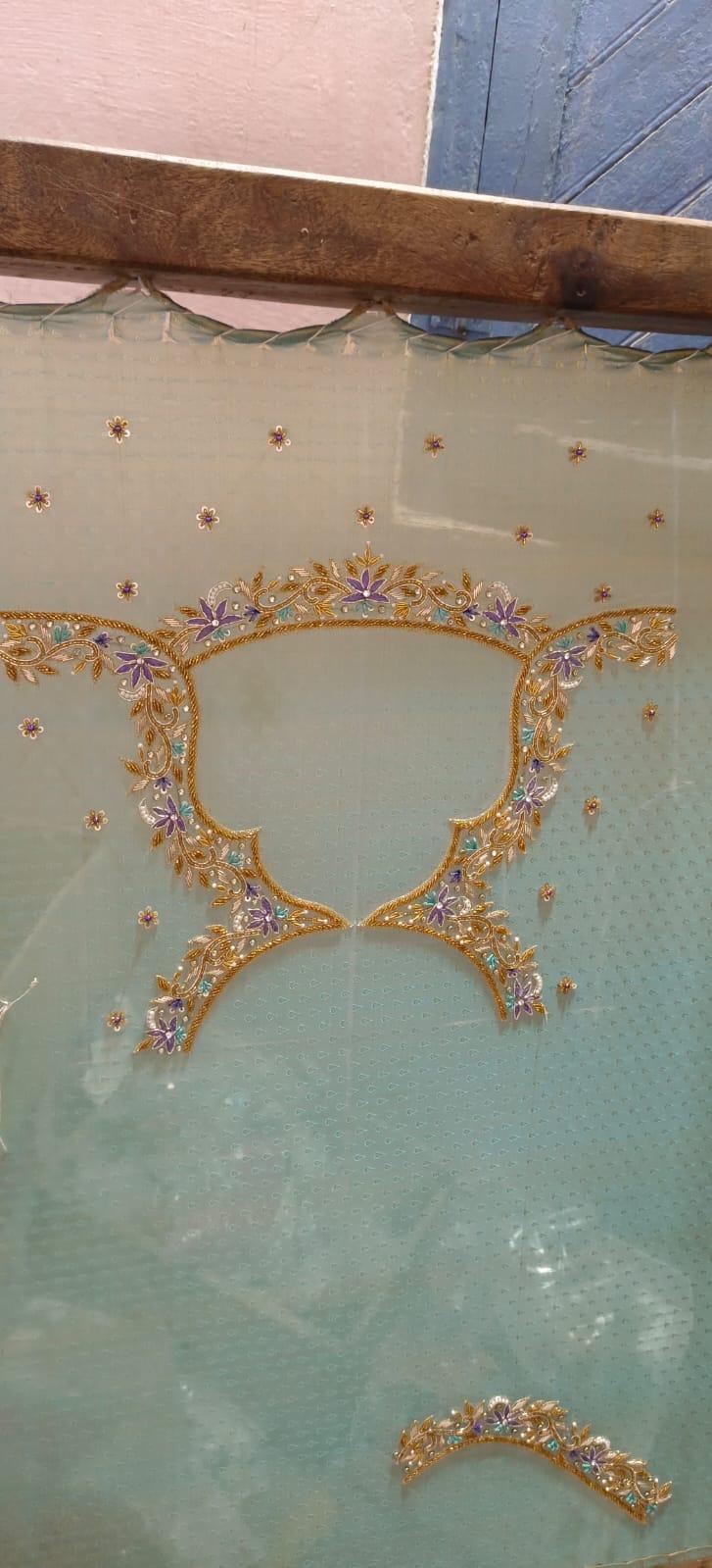 Gold ornate frame with purple gemstone flowers and scattered embellishments