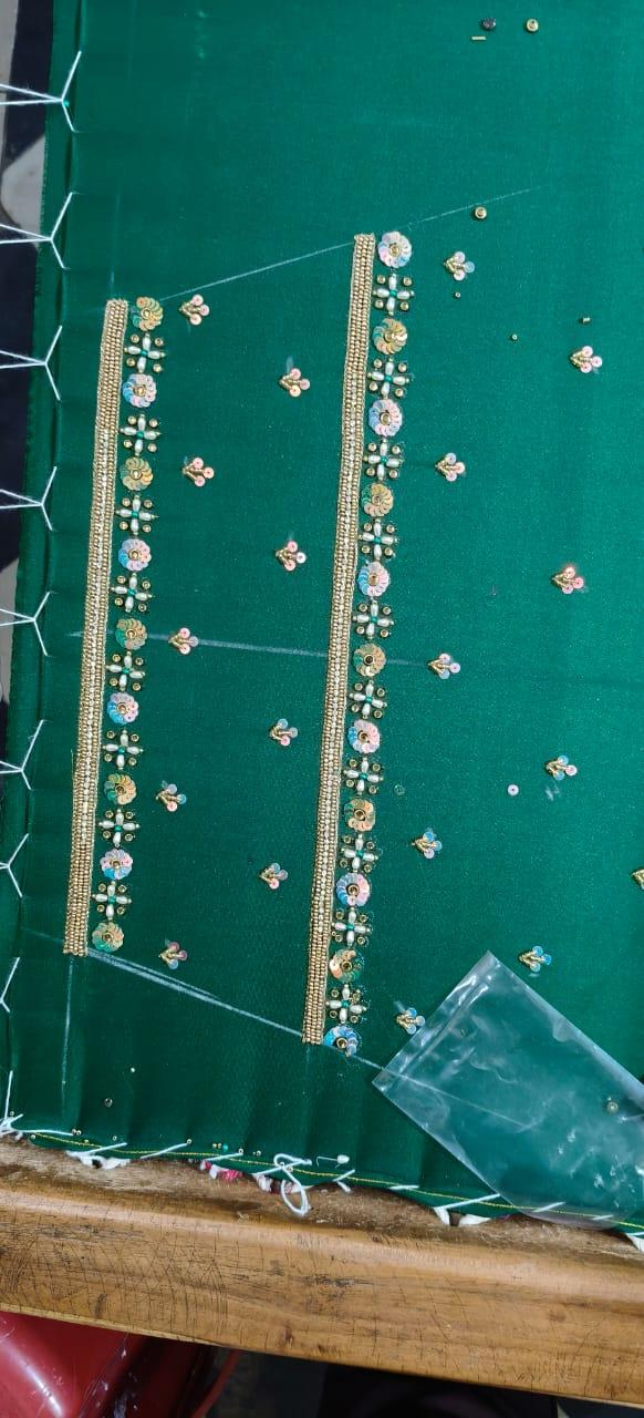Green circuit board with electronic components and gold accents