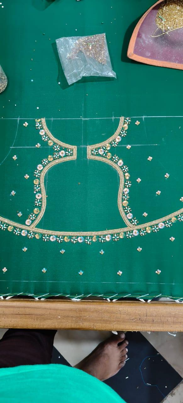 Green bridal blouse with gold zari and stone maggam work embroidery